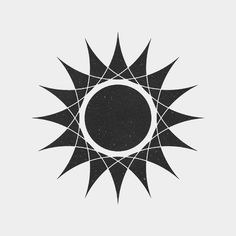 a black and white photo of a sun with an upside down design in the middle