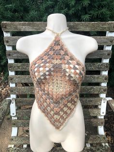 a crocheted halter top on a mannequin