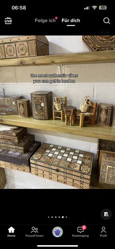 two shelves filled with wooden boxes on top of each other