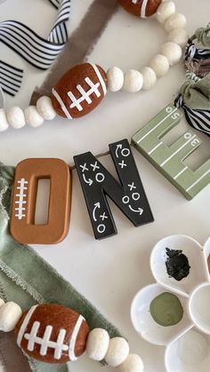 a table topped with football decorations and plates