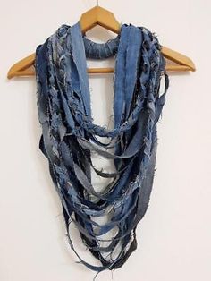 a blue scarf hanging on a wooden hanger