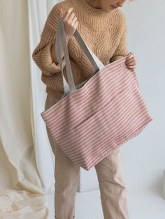 This red striped natural linen reversible tote bag is roomy enough for your day's carry, shopping, market, school, college, university, beach, sport, travel, and yoga. This shoulder bag is made of two-color NON SOFTENED natural Lithuanian linen. Two sleeve pockets inside and outside of the bag. IMPORTANT! The bag may shrink after the first wash ± 7%. ❤ SIZE ( width x high x deep) 16 x 14,5 x 6 inches (41 x 37 x 16cm). Handles 23,6 in (60 cm) long. ❤ CARE: Hand or machine wash (gently cycle) in 3 Tote With Pockets, Linen Christmas Stocking, Shopping Market, Spring Purses, Linen Baskets, Rough Linen, Linen Tote Bag, Beach Sport, Bag With Pockets