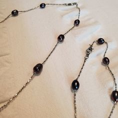 This Is A Lovely .925 Sterling Silver Chain With Dark Gray And Purplish Freshwater Pearls Necklace And Bracelet Set. The Pearls Are Each Unique With Slightly Different Colors And Shapes. The Chain Is Made With Long And Short Linkages Which Sparkle Nicely. Unused And In Great Condition. Comment With Any Questions. Tags: Elegant, Pearl Chain, Matching Set, Semiprecious Elegant Oval Jewelry With Sterling Silver Clasp, Classic Metal Pearl Necklace For Formal Occasions, Formal Oval Pearl Chain Jewelry, Formal Jewelry With Sterling Silver Clasp And Oval Shape, Formal Necklace With Sterling Silver Clasp, Formal Necklaces With Sterling Silver Clasp, Formal Metal Necklaces With Sterling Silver Clasp, Elegant Silver Chain Jewelry For Formal Occasions, Elegant Formal Silver Chain Jewelry