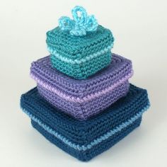 a stack of crocheted towels sitting on top of each other