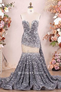 Dazzle in our Silver Velvet Sequin Mermaid Dress. Hand-sewn rhinestone plunging neckline, illusion cutout, and cascading ruffles. Perfect for a glamorous prom entrance! Heart Prom Dress, Prom Entrance, Sequin Mermaid Dress, Cascading Ruffles, Sequin Prom Dress, Strapless Neckline, Mermaid Dress, Silver Rhinestone, Long Prom Dress