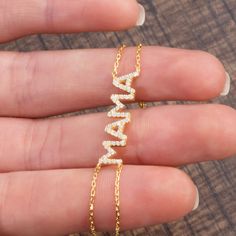 This 14k personalized diamond name bracelet is the perfect gift for the bridal party, someone special, or yourself. * All letters are capital.__________________________________________M A T E R I A L & L E N G T HAvailable in 14k Yellow Gold, 14k Rose Gold, 14k White Gold, Sterling SilverThickness: 1.2mm / 0.05"Initials: 6 mmDiamond: 0.15 ct. - 0.40 ct. depending on the nameColor: G Quality: SI-VSAdditional Notes:• Non-Conflict Diamonds• Made in the USA Elegant Name Bracelet With Diamond Accents, Elegant Gold Diamond Name Bracelet, Gold Name Bracelet With Diamond Accents, Elegant Metal Name Bracelet With Adjustable Chain, Luxury Personalized Diamond Name Bracelet, Mama Bracelet, Letter Bracelet, Initial Bracelet, Name Bracelet