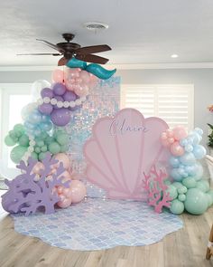 a mermaid themed birthday party with balloons and decorations