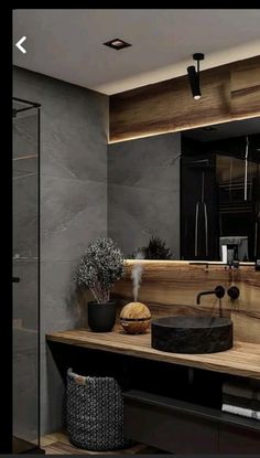 a bathroom with a wooden counter top next to a shower