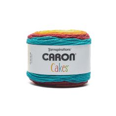 the yarn is multicolored and sits in front of a white background that says,'crayo cakes '