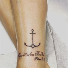 a woman with a tattoo on her arm that says hope anchors the world and an anchor