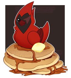 a red bird sitting on top of a stack of pancakes covered in syrup and butter