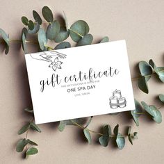 the gift certificate is surrounded by eucalyptus leaves