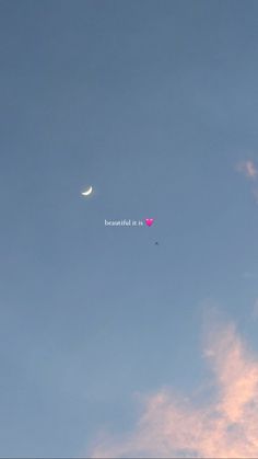 the moon and venus are visible in the blue sky, with pink clouds behind them