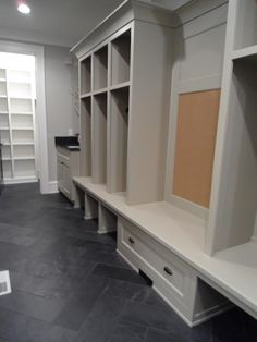 an empty walk in closet with built - in shelving