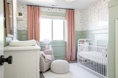 a baby's room is decorated in pastel colors