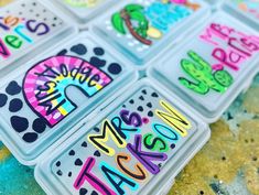 four plastic trays filled with magnets that say happy new year's eve