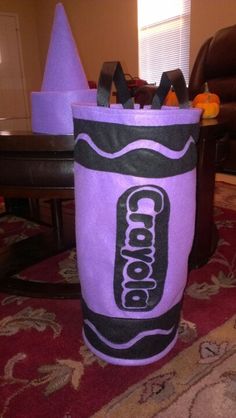 a purple cooler bag sitting on top of a red rug