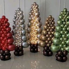 there are many balloons in the shape of christmas trees