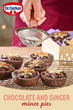 chocolate and ginger mince pies are being sprinkled with powdered sugar