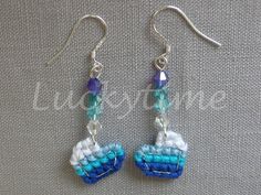 the earrings are made with blue and white beads