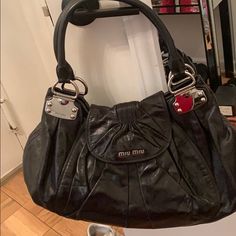 Black Patent Leather. Great Size Lots Of Space. Original Bag And Stuffing. Excellent And Pristine Condition Elegant Miu Miu Shoulder Bag For Evening, Black Top Handle Miu Miu Shoulder Bag, Miu Miu Satchel Shoulder Bag For Evening, Miu Miu Shoulder Bag With Detachable Handle For Evening, Miu Miu Evening Bags With Detachable Handle, Black Miu Miu Shoulder Bag With Top Handle, Miu Miu Shoulder Bag For Evening, Black Miu Miu Top Handle Shoulder Bag, Designer Miu Miu Bags