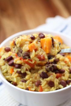 a white bowl filled with rice and beans