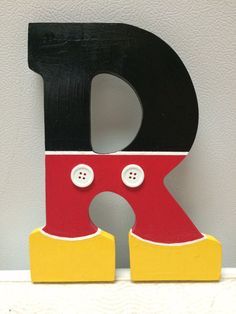 the letter d is painted red, yellow and black