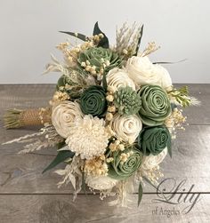 a bridal bouquet with white and green flowers