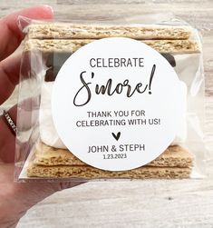 someone is holding up a small package of crackers that say, celebrate s'more thank you for celebrating with us