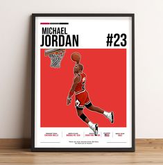 the michael jordan poster is hanging on a wall next to a wooden table with a basketball in it