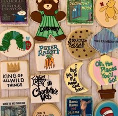 decorated cookies are arranged in the shape of children's books