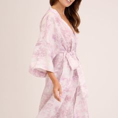 Custom print on linen. Small batch. Luxurious and delicate designs speak of the magic of summer inviting to relax. The robe kimono is cut for a relaxed fit, ensuring it looks flattering on many body shapes. It features generous kimono proportions and is fastened with a linen sash tie.   Linen is a naturally anti-static fabric that collects less dust and is therefore healthier for you. Linen is a 100% plant-based fabric. Its cultivation and production conserves water, does not pollute, does not l Ethereal Beach Dress For Spring, Ethereal Spring Beach Dress, Elegant Linen Dress With Floral Print, Elegant Linen Summer Kimono, Elegant Linen Kimono For Summer, Elegant Linen Summer Robe, Elegant Summer Linen Robe, Spring Feminine Robe With Kimono Sleeves, Feminine Summer Kimono For Loungewear