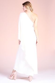 Gear up for your formal events with this angelic Soft Athena One Shoulder Maxi. This piece is made with our soft and beautiful poly silk, leaving you feeling luxurious and comfortable. The one shoulder is timeless and falls to the wrists, keeping you covered and ready for any weather climate that comes your way. One shoulder neckline Maxi length Draped sleeve Soft satin-like finish Self: 100% Poly | Lining: 100% Poly Made in USA SKU #: D-7756 One Shoulder Satin Gown For Wedding, One-shoulder Satin Gown For Wedding, Elegant One-shoulder Dress With Satin Finish For Wedding, Elegant Silk One Shoulder Wedding Dress, Pre-draped Silk One Shoulder Dress For Wedding, Pre-draped Silk One-shoulder Dress For Wedding, One Shoulder Wedding Gown With Satin Finish, Silk One Shoulder Dress For Wedding With Asymmetrical Neckline, One Shoulder Gown For Wedding Guest