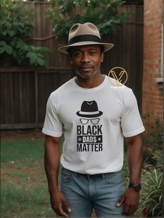 Represent your black culture in a comfortable and durable way with our Black Dads Matter Tee. Made from 100% airlume soft cotton, this one-of-a-kind shirt is perfect for celebrating Father's Day. Orders are shipped within 3-5 business days. Casual Cotton Tops For Father's Day, Casual Fitted Tops For Father's Day, Fitted Casual Tops For Father's Day, Casual Black T-shirt For Father's Day, Black T-shirt For Streetwear, Father's Day Black Relaxed Fit T-shirt, Black Relaxed Fit T-shirt For Father's Day, Casual Black Top For Father's Day, Black Fathers