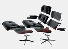 the eames chair and ottomans are all in different positions, including one with a footstool