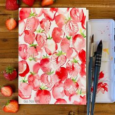 strawberries and cherries painted on a paper with watercolor pencils next to it