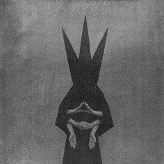 a black and white photo of a person with their hands in the air above them