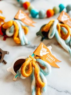 there is a small orange and blue octopus decoration on the table next to other decorations