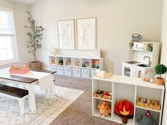 a living room filled with lots of furniture and decor on top of carpeted flooring