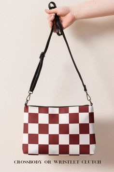 Keep your style on point and your hands free with our versatile Maroon Checkerboard crossbody bag. It’s made of premium faux leather and features dark gray hardware. Thanks to the zip-top closure and multiple inside pockets, you can keep your essentials secure and organized. Transform this crossbody bag with removable wrist and shoulder straps to style it for day-to-night looks. Everyday Square Clutch With Detachable Strap, Trendy Square Bag With Zipper Pouch, Trendy Square Bags With Zipper Pouch, Square Clutch With Adjustable Strap For Travel, Trendy Square Shoulder Bag With Zipper Pouch, Square Clutch With Adjustable Strap For Everyday, Everyday Square Clutch With Adjustable Strap, Trendy Clutch Pouch With Adjustable Strap, Checkered Bag