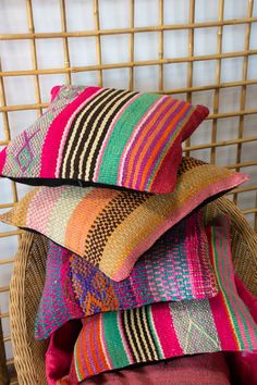 colorful pillows stacked on top of each other