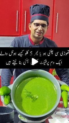 a man is holding a bowl of green soup