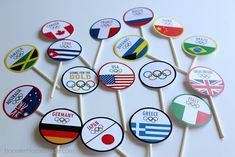 the olympic badges are on top of lollipop sticks