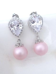 This earring features a rare and beautiful matt soft blush light round pink pearl (10 mm) , dangle from a white gold plated cubic zirconia earwire. Simple and yet beautiful.Size: 2.4 x 1.0 cmFor more pearl jewelry:http://www.etsy.com/shop/JCBridalJewelry?section_id=10547516For more gemstone jewelry, please visit my other shop: JCGems Jewelry - http://www.etsy.com/shop/JCGemsJewelry?ref=si_shop, Elegant Pink Pearl Charm Jewelry, Hypoallergenic Pink Jewelry For Formal Occasions, Elegant Pink Sterling Silver Teardrop Earrings, Classic Pink Drop Jewelry, Pink Pearl Drop Round Earrings, Pink Pearl Drop Teardrop Earrings, Elegant Pink Teardrop Pearl Earrings, Pink Teardrop Pearl Earrings For Formal Occasions, Pink Teardrop Pearl Drop Earrings