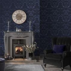 a living room with blue wallpaper and a fireplace