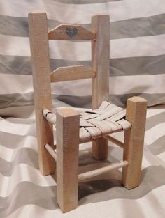 a wooden chair made out of wood sticks