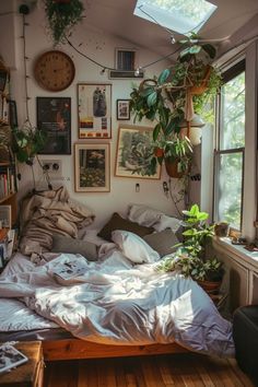 an unmade bed with lots of pillows and plants on the wall next to it