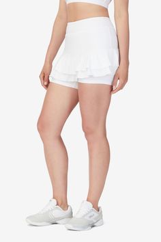 A fun ruffle design helps this skort serve up style wins on the court. Check it out in 2 different color combos, you may need both. Iconic Everywhere. #FILAstyle Style # TW23B906.  Division: Apparel. Ruffle Skort, Wrap Front Dress, Ruffle Design, Tennis Skort, Design Help, The Court, Up Styles, Color Combos, Division