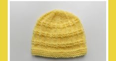 a yellow knitted hat on a white background