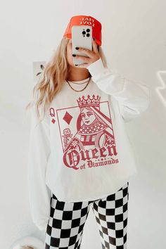 Meet your new favorite graphic sweatshirt! Featuring a classic crew neckline, long sleeves, and a bold "Queen of Diamonds" graphic print, this sweatshirt offers an oversized fit for maximum comfort and style. Crew neckline Long sleeves Queen of Diamonds graphic print Oversized fit 50% Cotton/50% Polyester Fit and sizing: Measurements are approximate. Length measurements are taken from the top of the shoulder to the bottom hem lying flat. Small/Medium - Bust: 44", Waist: 44”, Hip: 36”, Length: 27” Medium/Large - Bust: 52”, Waist: 52", Hip: 42”, Length: 27.5” See Lily's sizing HERE, she is wearing size Small/Medium See Margie's sizing HERE, she wears size Medium/Large Aka Apparel, Queen Of Diamonds, Diamond Graphic, Logo Desing, Fun Run, Large Bust, Measurement Length, Oversized Fits, Crew Neckline